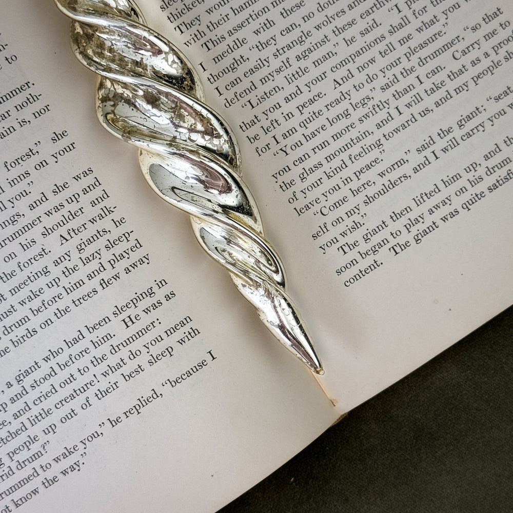 Glass spiral silver ornament.