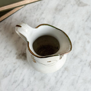 Antique ironstone green and gold pitcher.