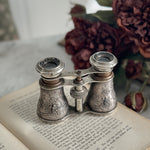 Vintage bird embossed opera glasses.