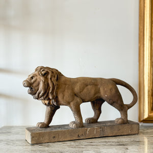 Aged brown Concrete Lion Statue.