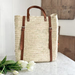 Woven Backpack with leather strap.