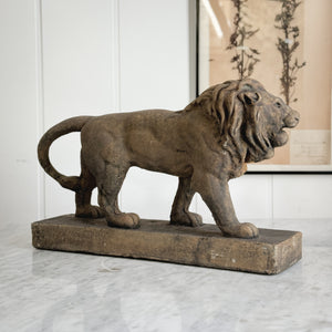 Aged brown Concrete Lion Statue.