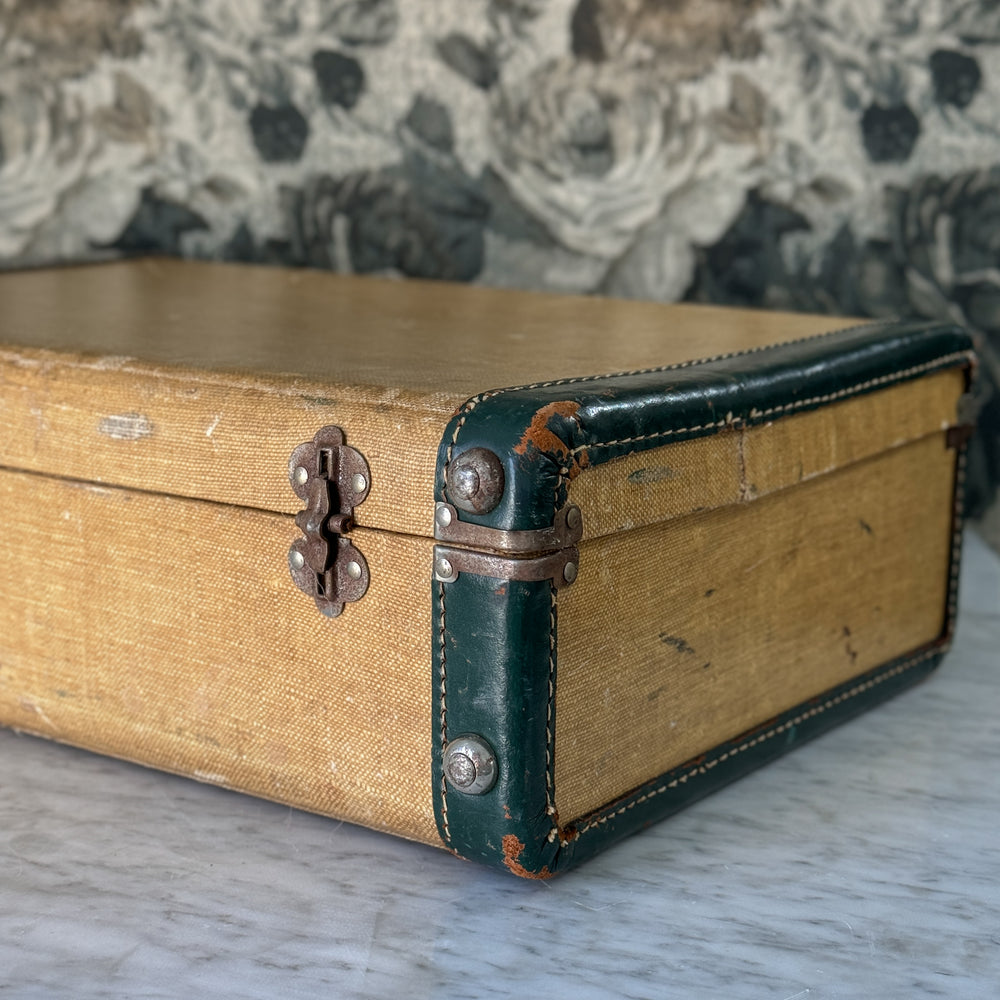 Vintage green and leather suitcase.