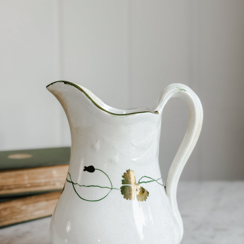 Antique ironstone green and gold pitcher.