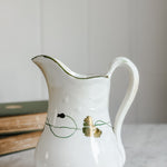 Antique ironstone green and gold pitcher.