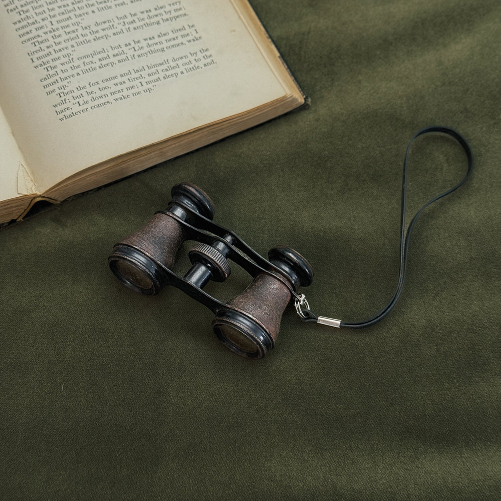 Vintage black strap opera glasses.
