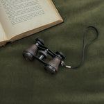 Vintage black strap opera glasses.