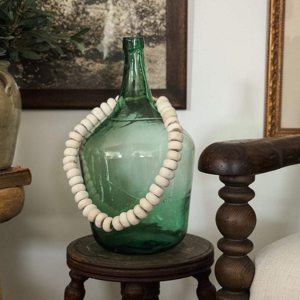 Vintage green European demijohn.