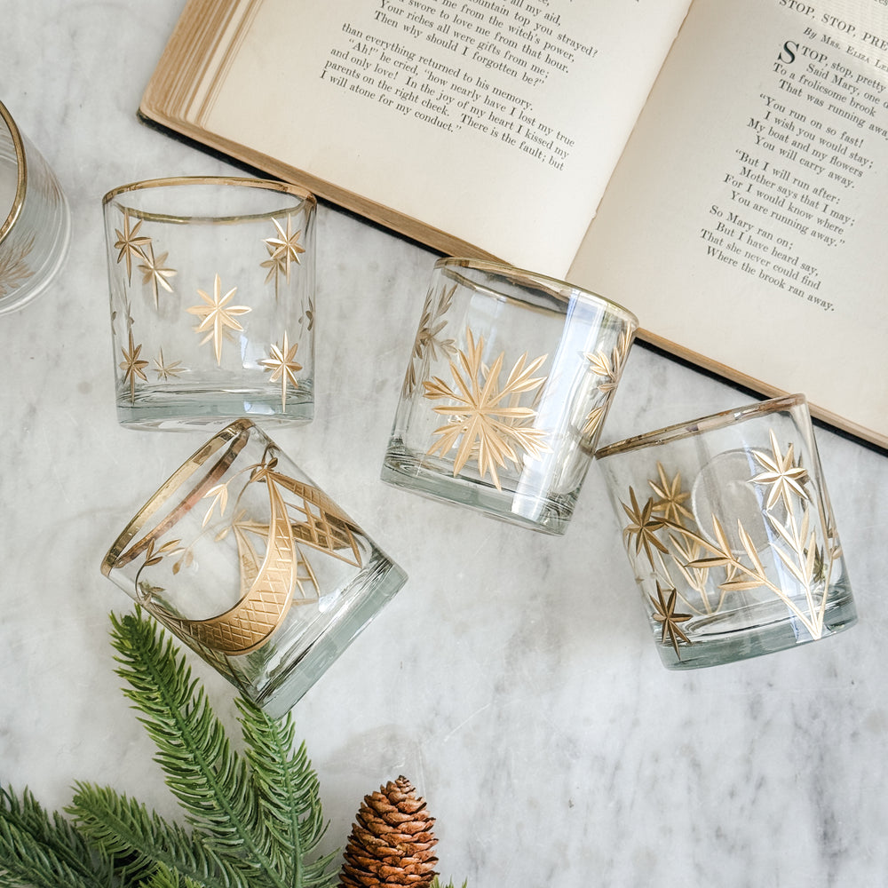 Etched gold glass votive holder.