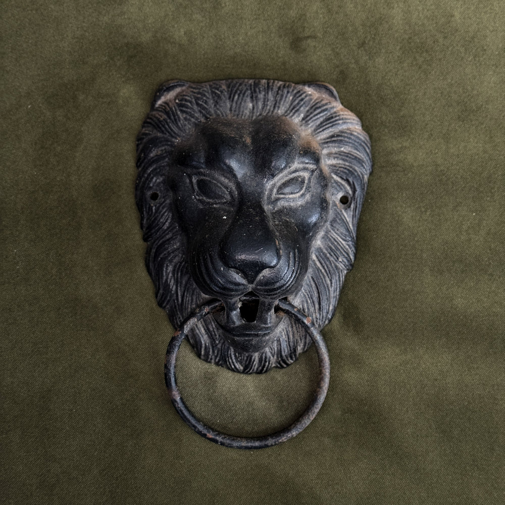 Vintage black lion door knocker.