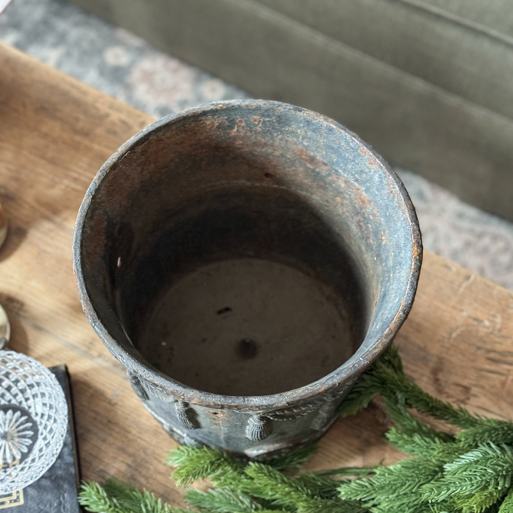 Vintage cast iron tassel planter.