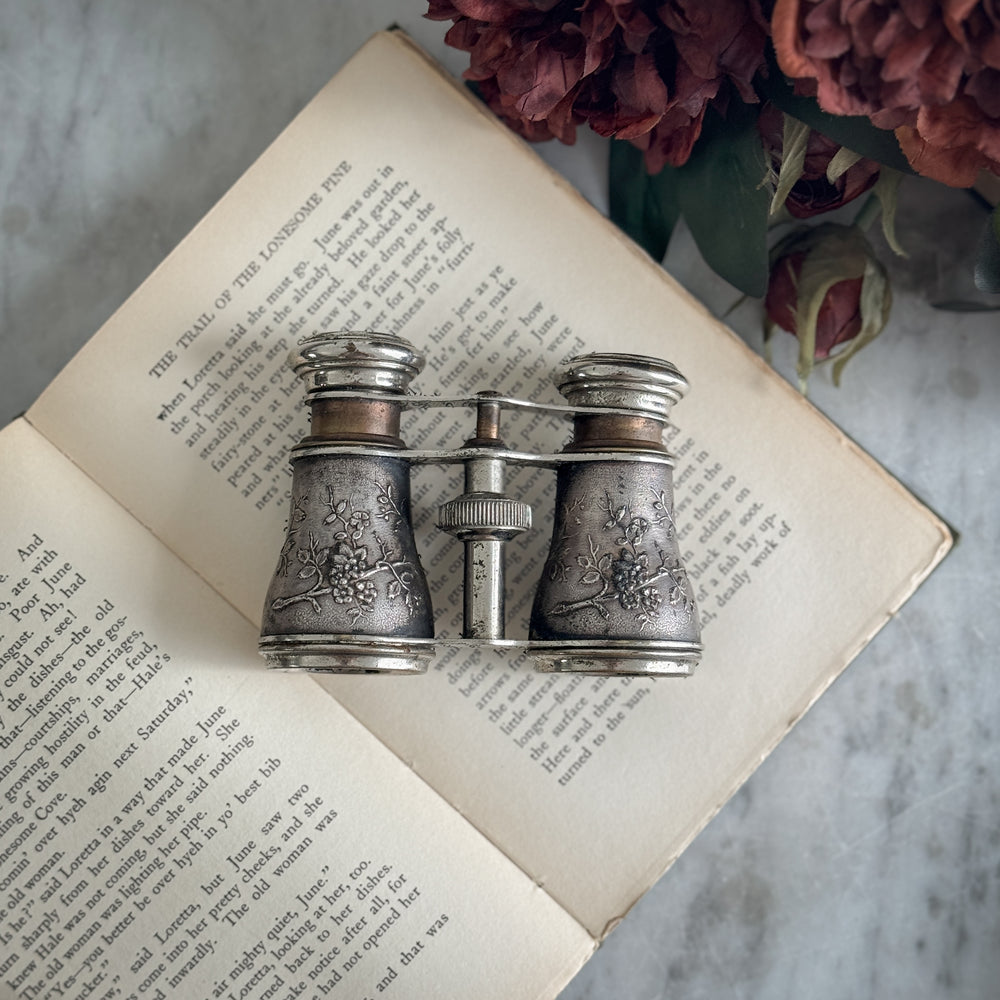 Vintage bird embossed opera glasses.