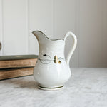 Antique ironstone green and gold pitcher.