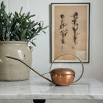 Vintage copper watering can.