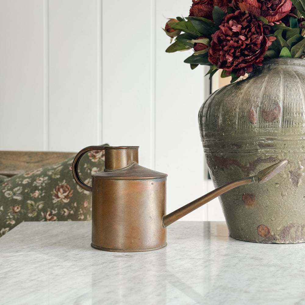 Vintage copper English watering can.