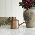 Vintage copper English watering can.