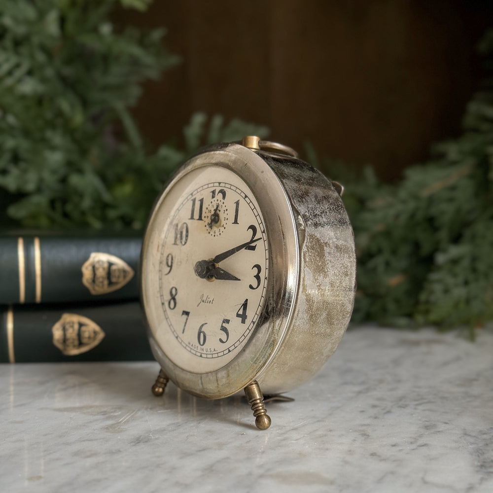 Vintage silver footed Juliet clock.