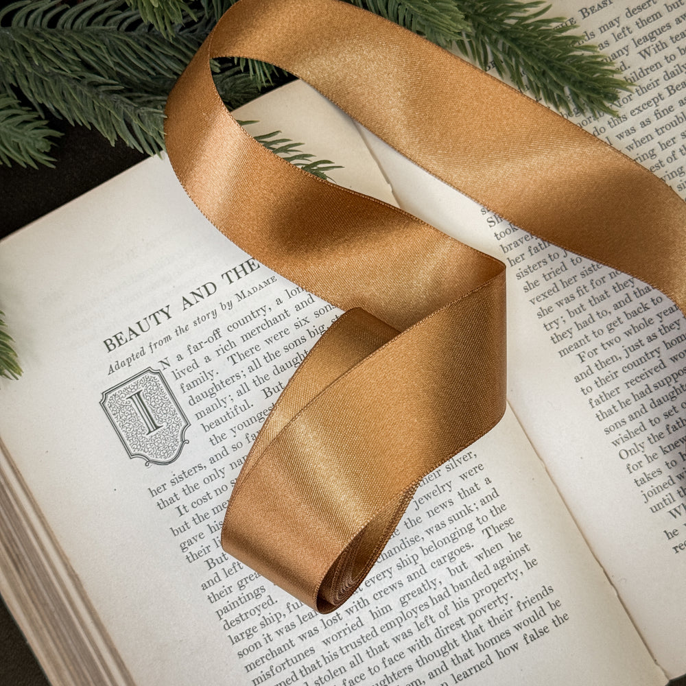 Antiqued gold satin ribbon.