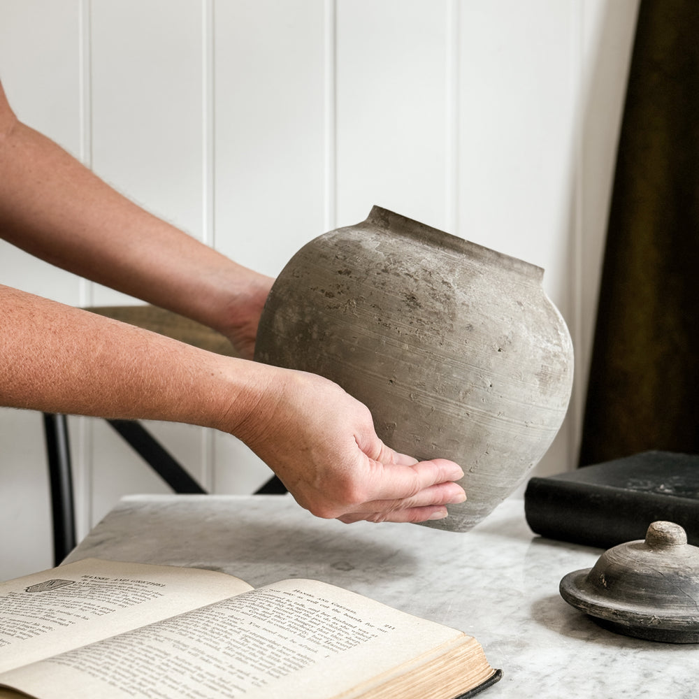 Vintage black pottery vase w/lid.