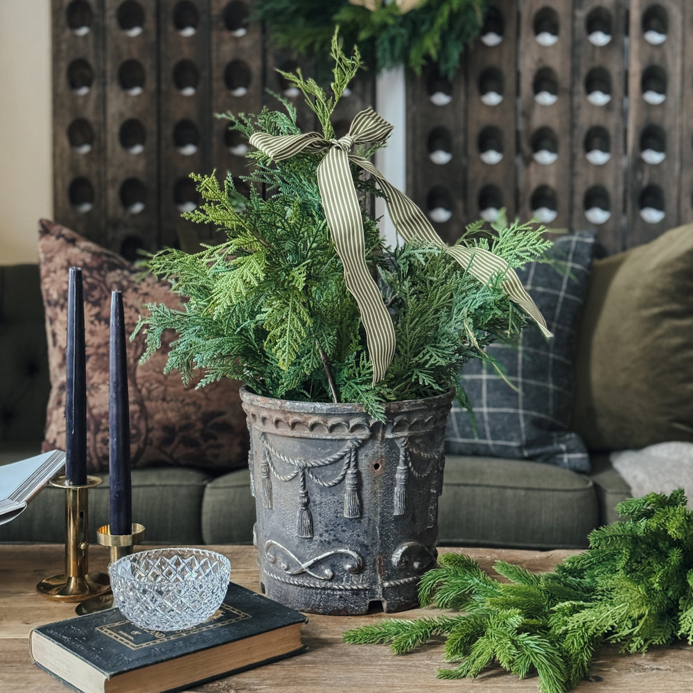Vintage cast iron tassel planter.