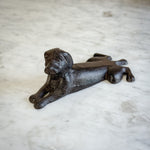 Cast iron dog door stop