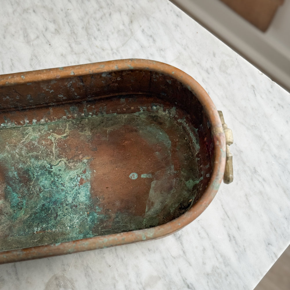 Vintage copper handled planter.