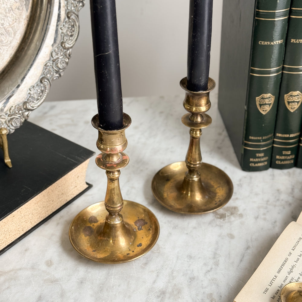 Vintage brass taper pair.