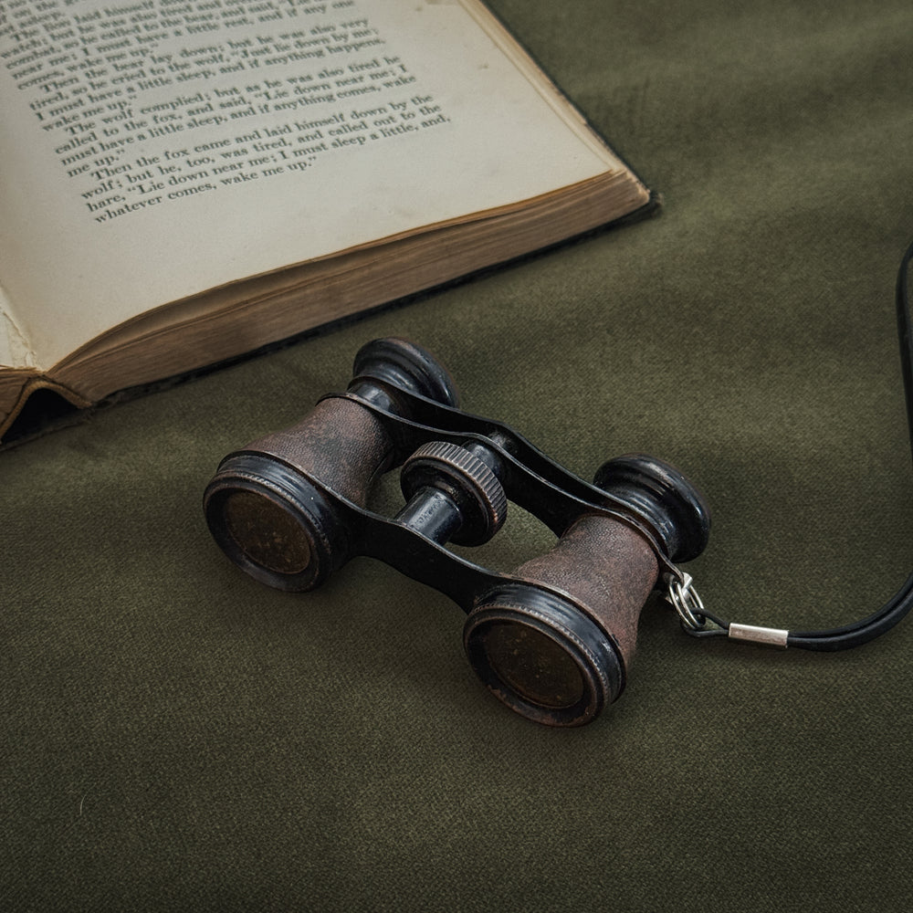 Vintage black strap opera glasses.