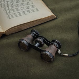 Vintage black strap opera glasses.