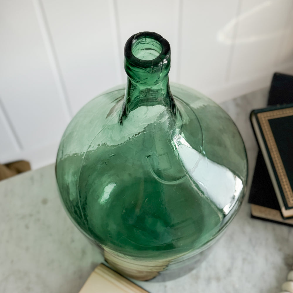 Vintage green European demijohn.