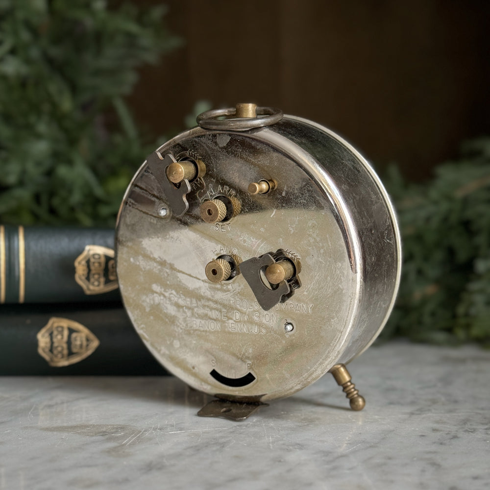 Vintage silver footed Juliet clock.