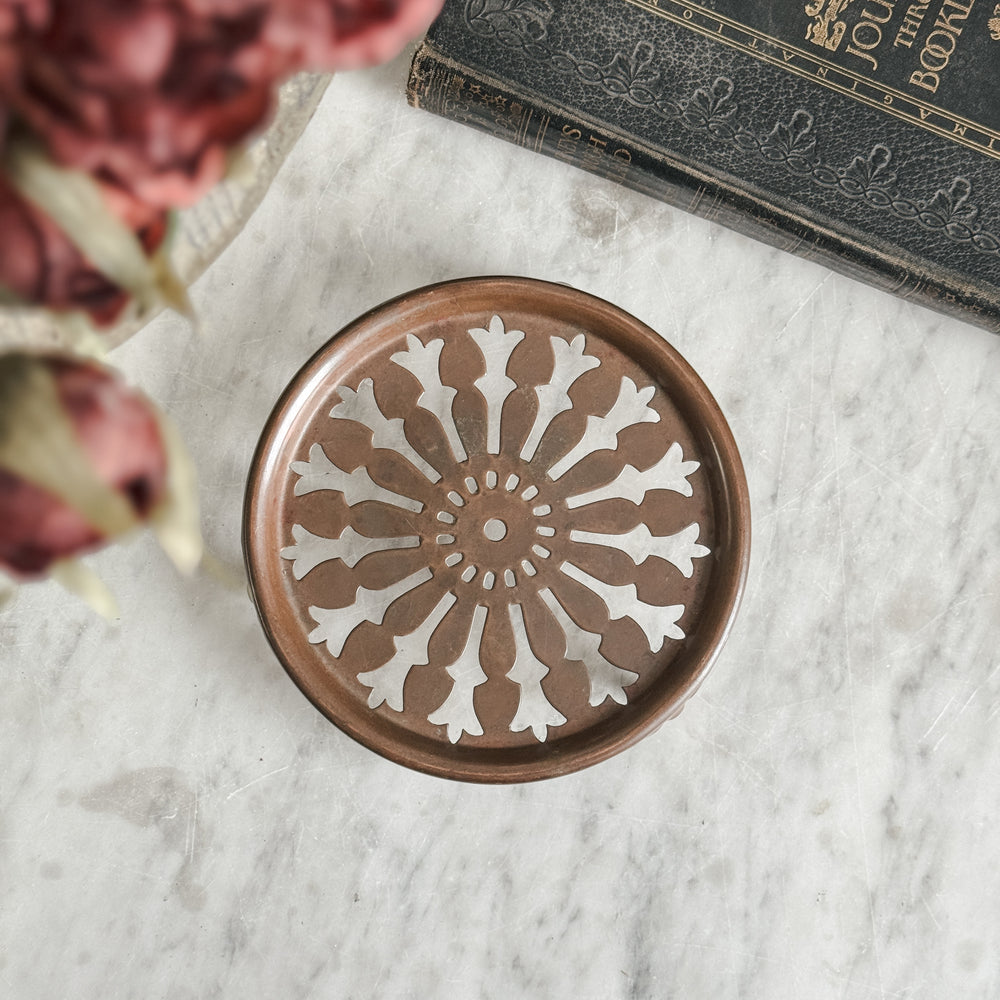 Vintage copper trivet.
