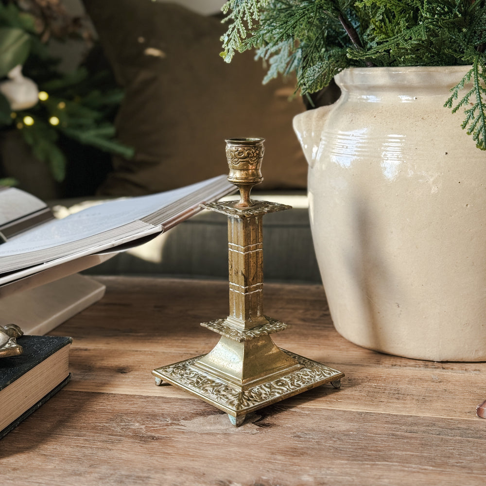 Vintage brass embossed footed taper candleholder.