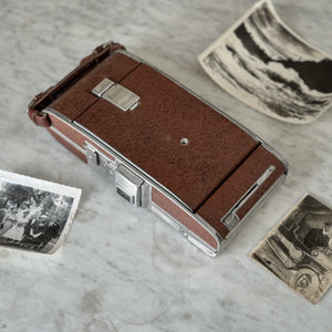 Vintage brown Polaroid land camera.