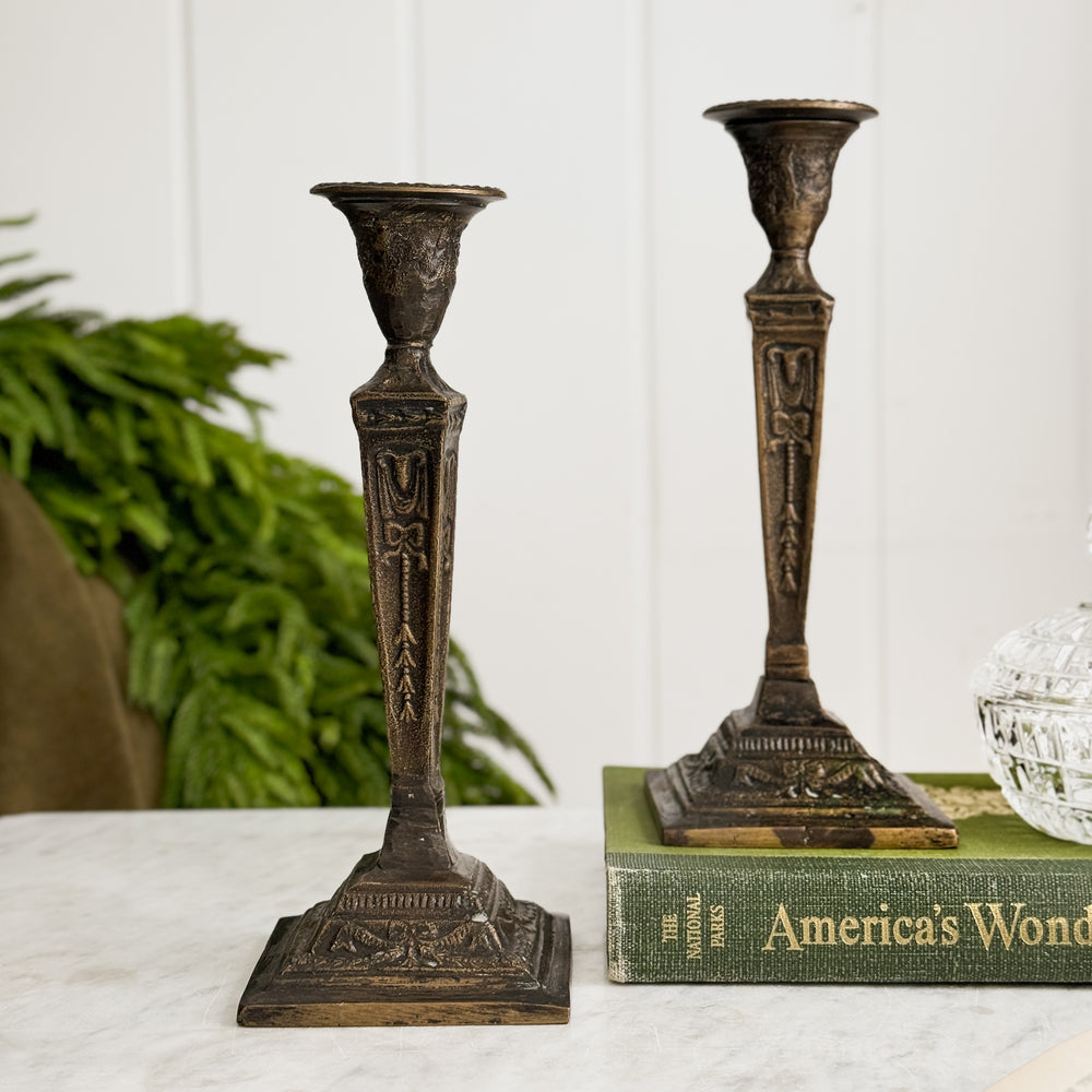 Vintage bronze taper candleholder pair.