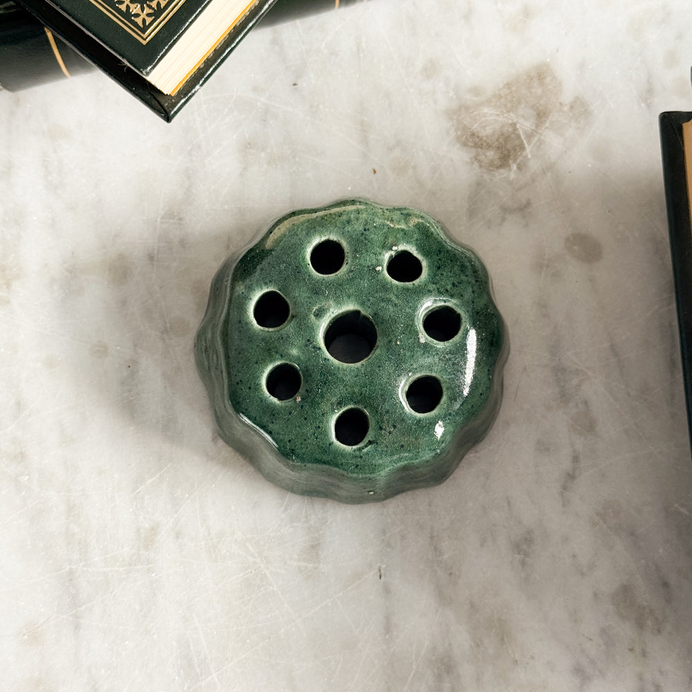 Vintage green pottery flower frog.
