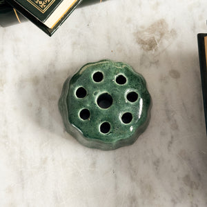 Vintage green pottery flower frog.