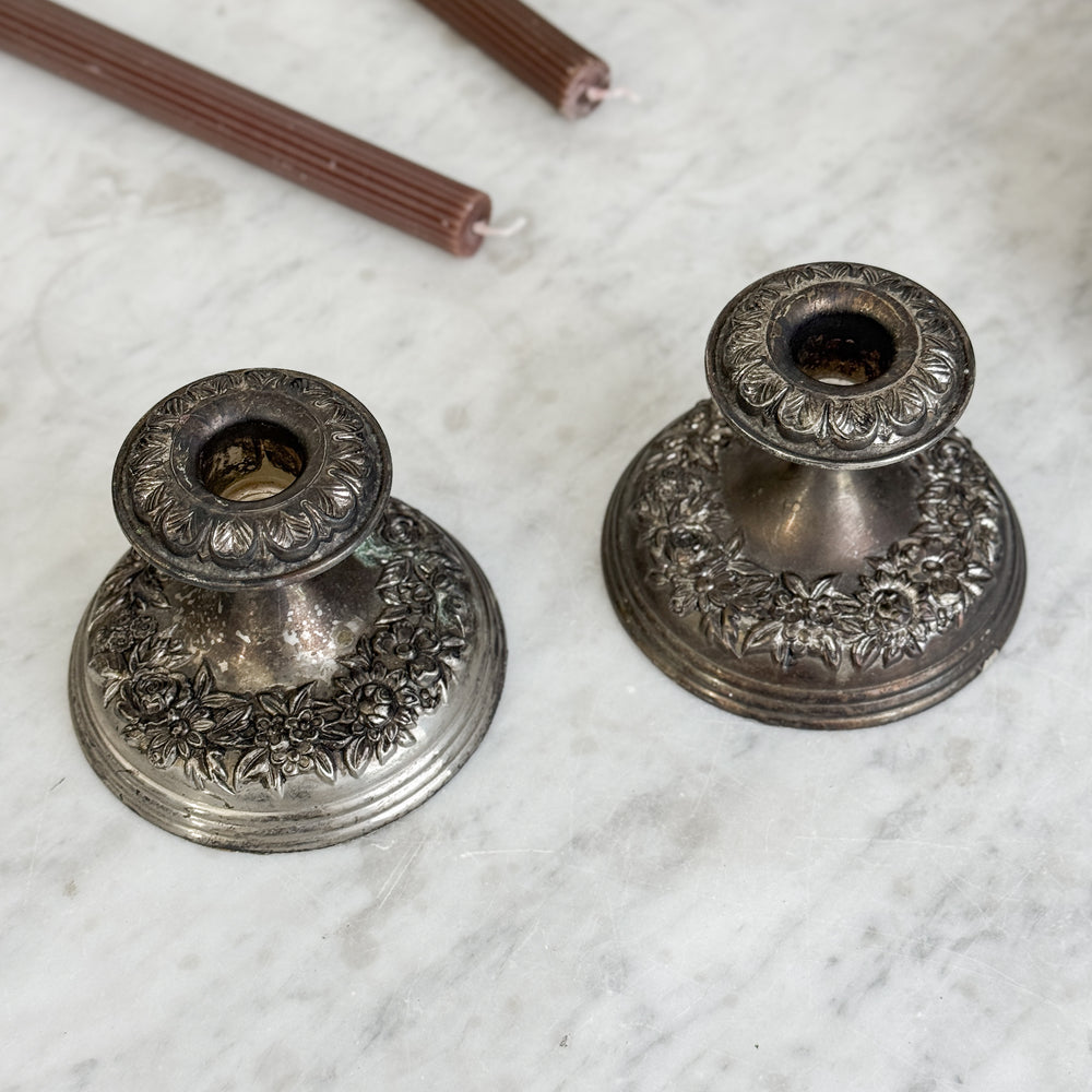 Vintage floral silverplate taper candle pair.