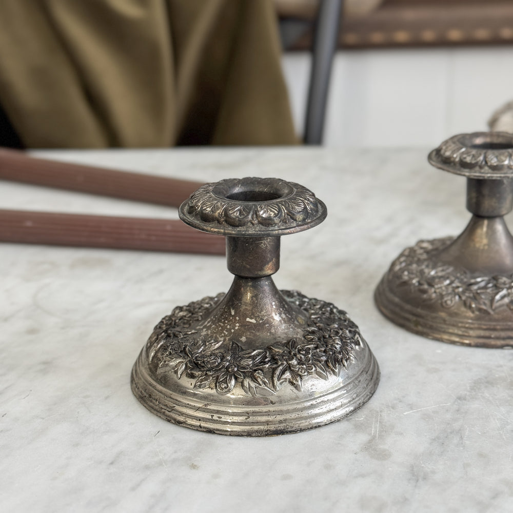 Vintage floral silverplate taper candle pair.
