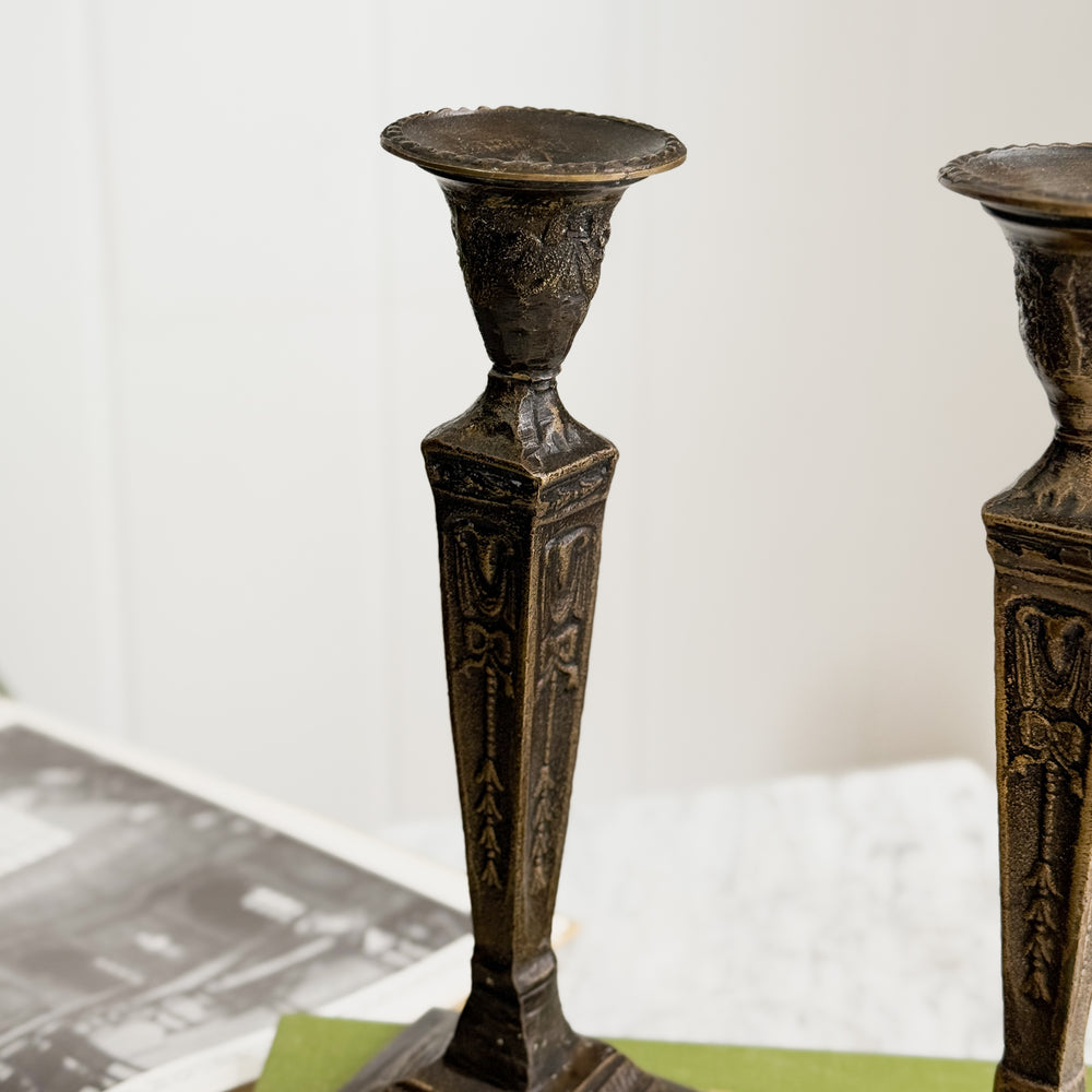 Vintage bronze taper candleholder pair.