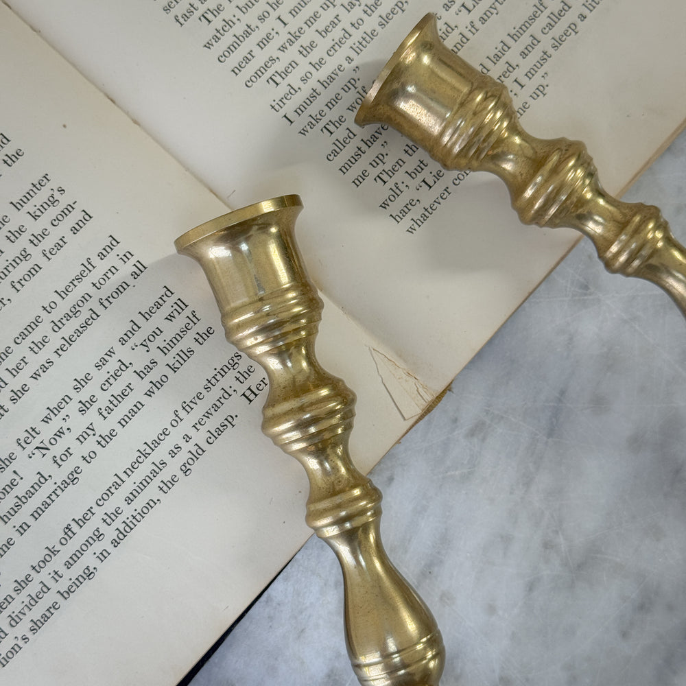 Vintage brass pair slim candlesticks.