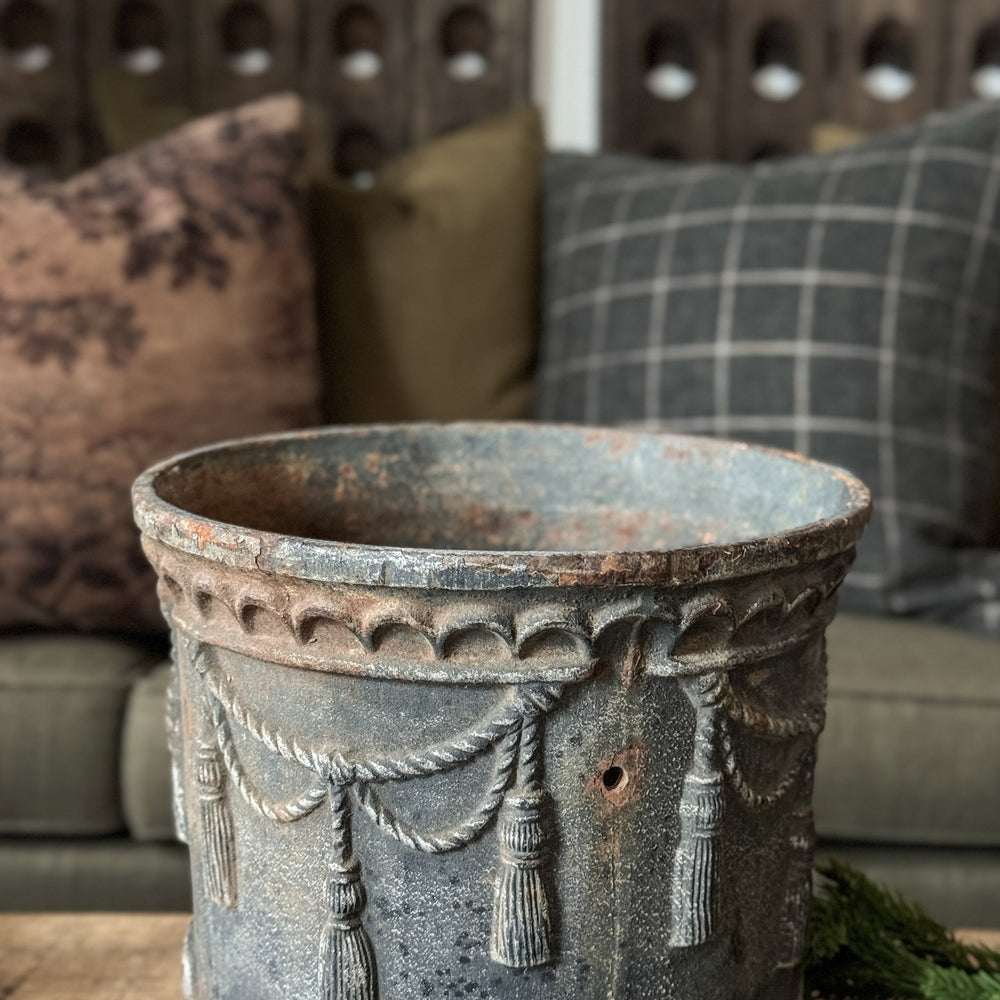 Vintage cast iron tassel planter.