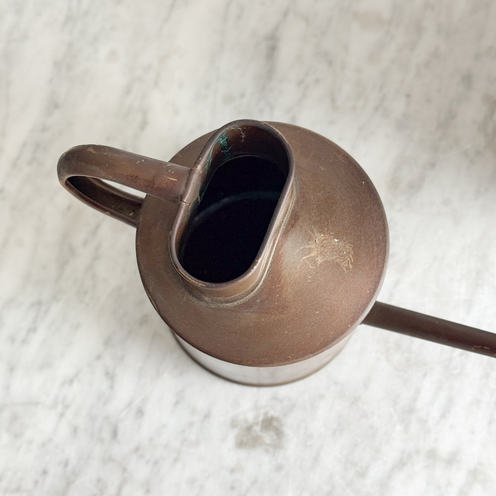 Vintage copper English watering can.