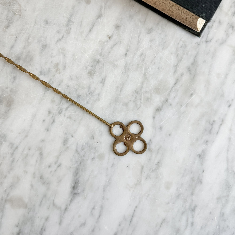 Vintage brass candle snuffer.