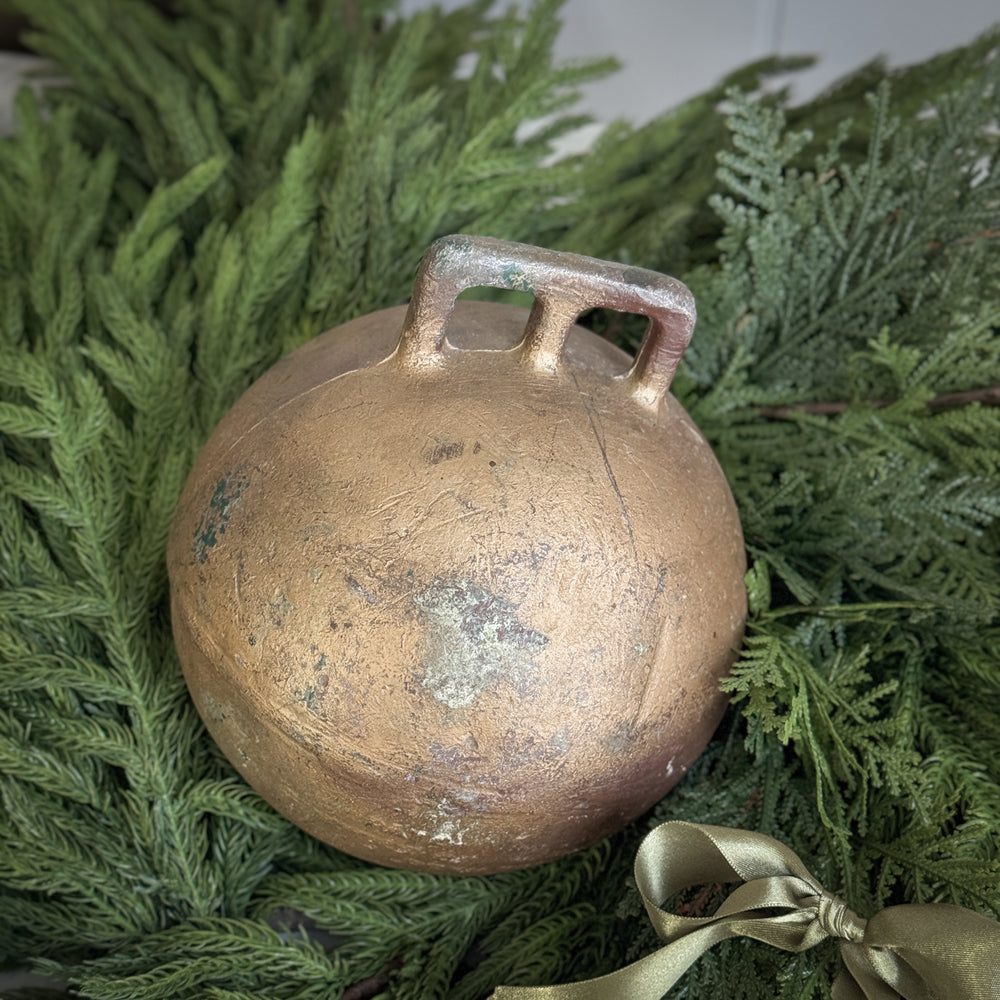 Vintage gold metal fishing float.