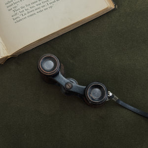 Vintage black strap opera glasses.
