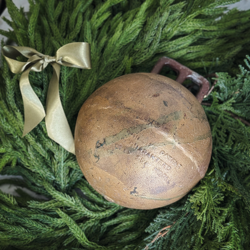 Vintage gold metal fishing float.