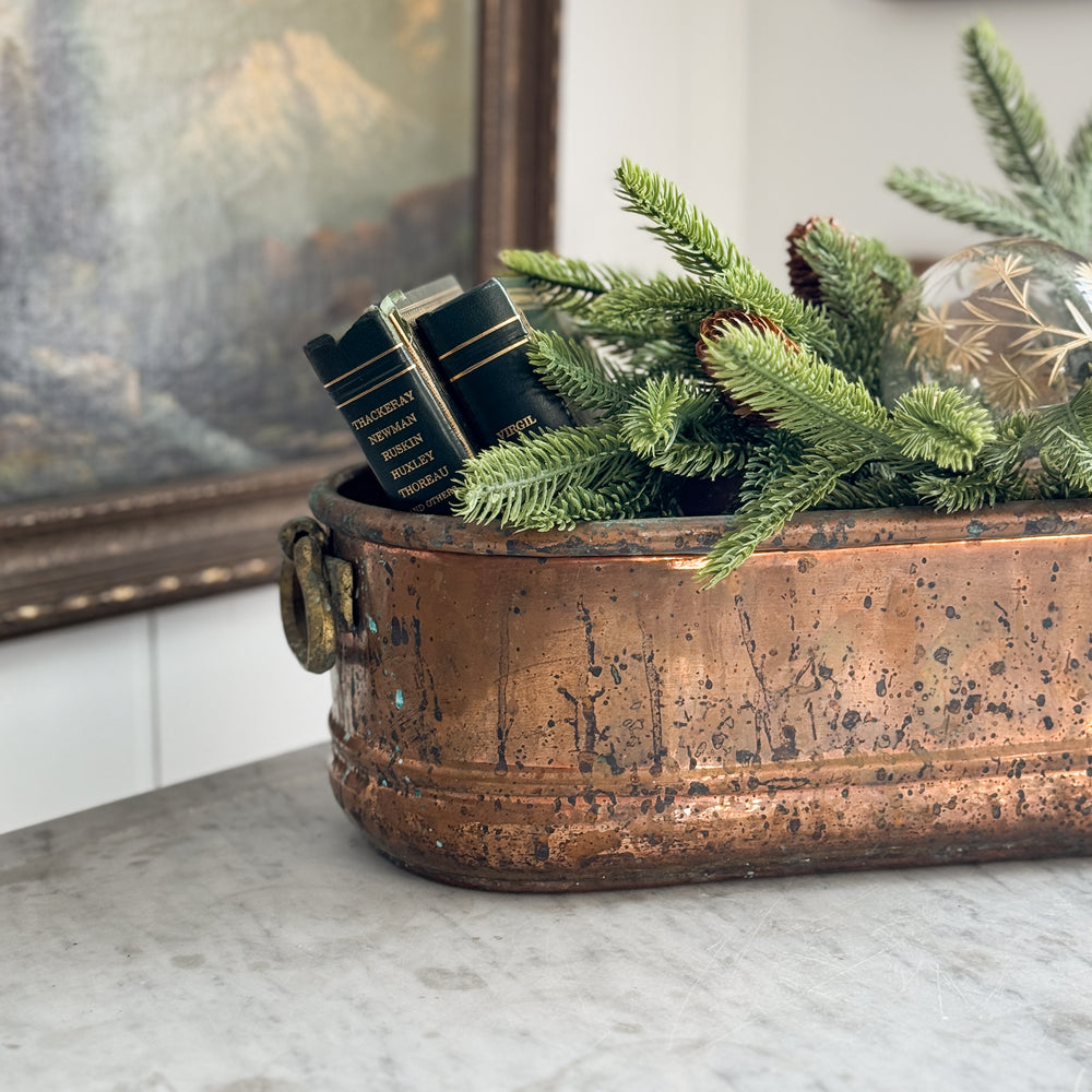 Vintage copper handled planter.