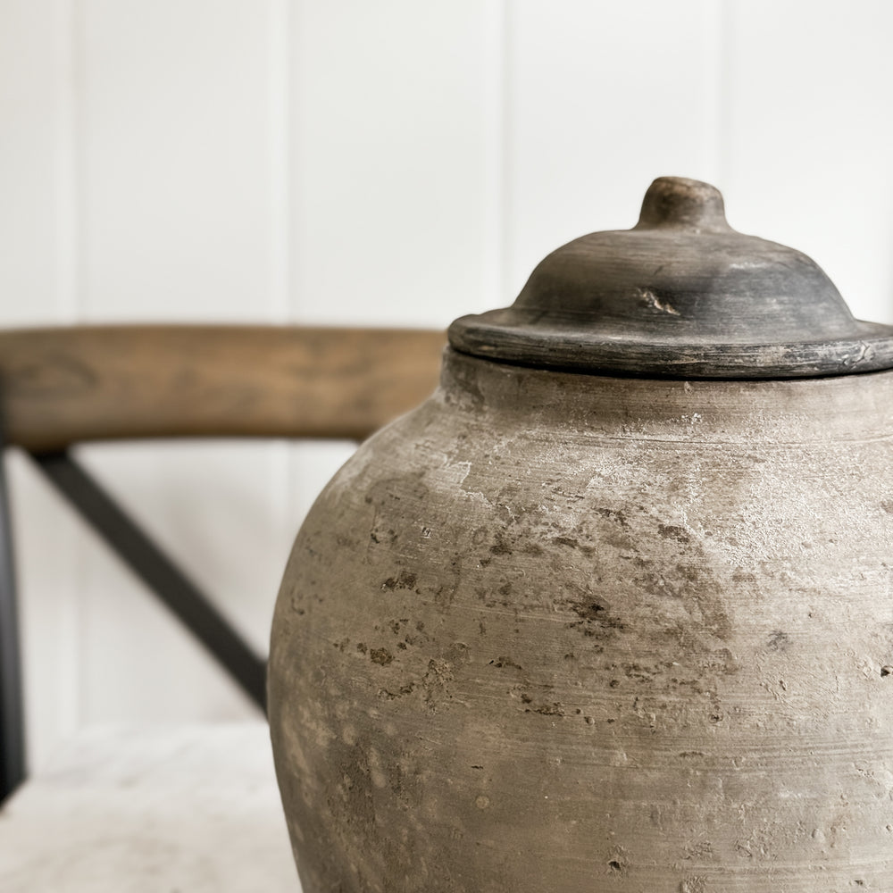 Vintage black pottery vase w/lid.