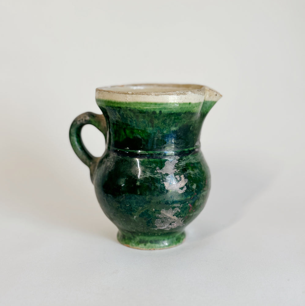 Vintage green pottery pitcher